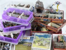 A large selection of Warhammer table top war game figurines and scenery, various armies including