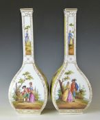 A pair of Dresden porcelain pedestal vases decorated with Watteau scenes, H31cm