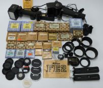 Nikon camera accessories to include MD-12 auto winder, SU-11 and SB-14 speedlight, lens hoods