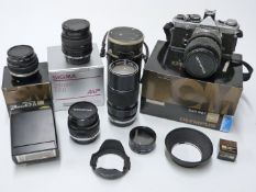 Olympus OM-2n camera outfit comprising OM-2n with 28mm 1:2.8, 50mm 1:1.4, 35-70mm 1:4 and 75-150mm