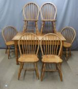 A bespoke oak extending table and six chairs in the Arts & Crafts style, made by US Amish craftsmen,