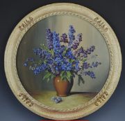 H Shaw oil on board 'Delphiniums' still life of flowers and vase, in circular frame, signed lower