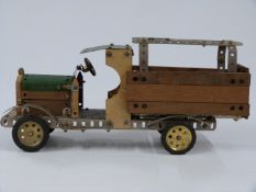 Meccano or Butcher & Sons Primus model of a lorry, made using green, unpainted and wooden parts,