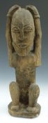 African tribal Yoruba carved figure of a man with hands on head, H39cm
