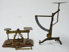 Set of brass postal scales on wooden base with weights, together with a set of continental postal