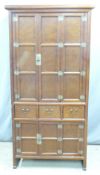 Chinese or Korean elm cabinet or wardrobe with hinged doors to top, three drawers to middle and