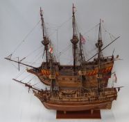 Two wooden models of galleons, both on stands, largest L88 x H70cm
