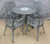 A cast metal circular garden table and four chairs, diameter 79 x H73cm