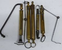 Five Salter spring balances comprising three ratcheting examples, one with ministry broad arrow mark