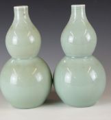 A pair of Chinese celadon glazed double gourd vases, H22cm