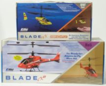 Two E-flite Blade radio controlled helicopters CX2 and MCX, both in original boxes.