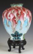 A late 19th/20thC Japanese Ginbari silver vase on stand, decorated with red tendrils on a pale