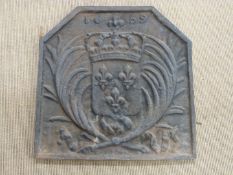 A cast iron fire back, W60cm