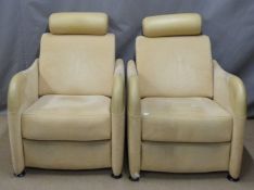 A pair of Ligne Roset designer reclining armchairs
