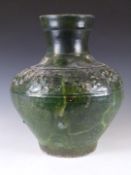Chinese Han dynasty green glazed terracotta pottery vase decorated with a frieze of animals, with