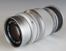 Leitz Elmar f=9cm 1:4 camera lens, serial number 1603841, with Leica type screw mount, in bubble