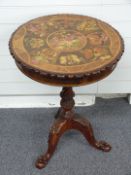 A specimen wood tilt top circular side table with marquetry decoration of butterflies and flowers,