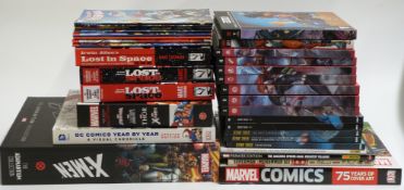Thirty-two DC and Marvel comic related books including X-Men The Adamantium Collection, DC Comics
