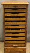 Crusader oak tambour fronted collector's chest or filing cabinet with nine drawers, brass fittings
