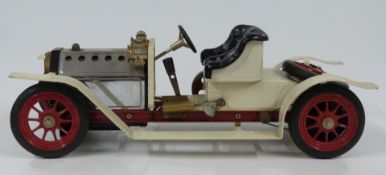 Mamod SA1 live steam roadster car with cream body and wings.
