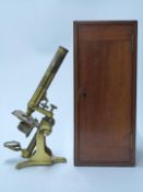 A 19thC brass microscope, in fitted mahogany box with Stanley and Beck cased attachments and