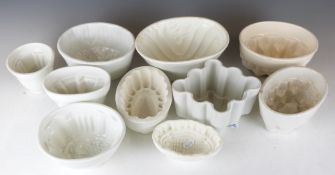 A large quantity of vintage porcelain jelly moulds including Shelley
