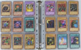An album of over 1000 Konami Yu-Gi-Oh trading cards including shiny examples.