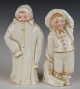 Two Royal Worcester Kate Greenaway candle snuffers with puce marks, H10cm