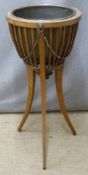 19th or early 20thC jardinere with brass bowl, raised on three legs, H75cm