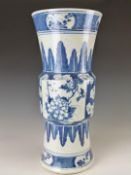 WITHDRAWN    A 19thC Chinese blue and white Gu vase with stylised acanthus leaf and prunus