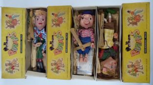 Three Pelham puppets Pinky, Hansel and Gretel, all in original boxes.