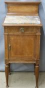 Mahogany marble topped bedside cabinet  with inlaid decoration and single drawer over cupboard
