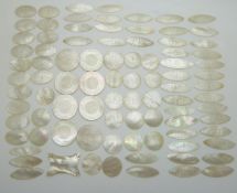 A collection of Chinese mother of pearl counters, mostly carved with a pagoda, includes 28 circular,