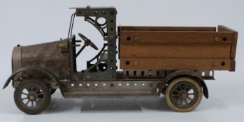 Meccano or Butcher & Sons Primus model of a lorry, made using green, unpainted and wooden parts,