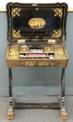 A 19thC Chinese lacquer needlework/sewing workbox table with fitted interior and carved bone