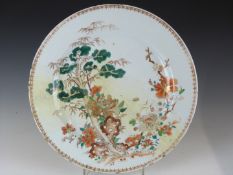A 19thC Chinese charger decorated with flora and fauna, diameter 39cm