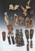 A collection of carved wooden figures of Eastern and African origin, tallest 28cm