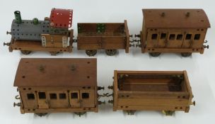 Meccano or Butcher & Sons Primus model of a train comprising locomotive, two coaches and two wagons,