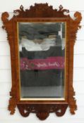 A mahogany wheatear mirror with bevelled glass and crossbanded rosewood and gilt decoration,