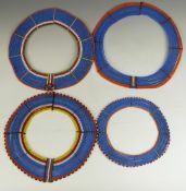 Four African tribal Masai beaded necklaces possibly to be worn together, largest diameter 37cm