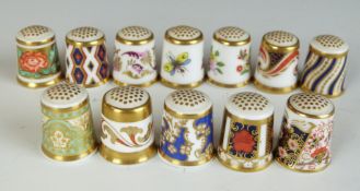 A collection of Royal Crown Derby thimbles including Imari examples