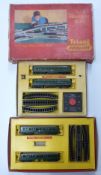 Two Tri-ang 00 gauge model railway train sets together with an empty Tri-ang No.1 Passenger set box.