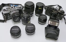 Olympus SLR camera outfit to include OM-1 with 24mm 1:2.8 lens, OM-2n, Olympus 135mm 1:3.5, 28mm 1: