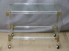 A designer metal bound perspex and glass buffet trolley, W80 x  D40 x H64cm