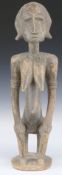 African tribal Bamana carved fertility / maternity figure resting on a stool, H49cm