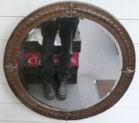 Arts and Crafts / Art Nouveau copper framed circular mirror with bevelled glass, diameter 55cm