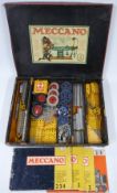 Meccano Outfit 4 with blue, yellow and gold parts, in reproduction box with instructions.