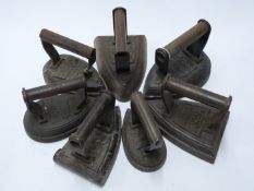 Seven Salter flat irons comprising numbers 1, 3, 4 and 6 pear shaped examples and number 4 and two