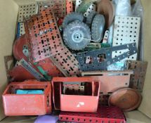A collection of Meccano or similar parts including vehicle cabs.
