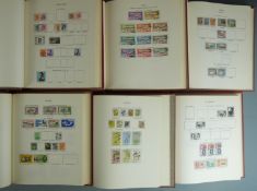 Six New Age Commonwealth QEII stamp albums, mainly used stamps